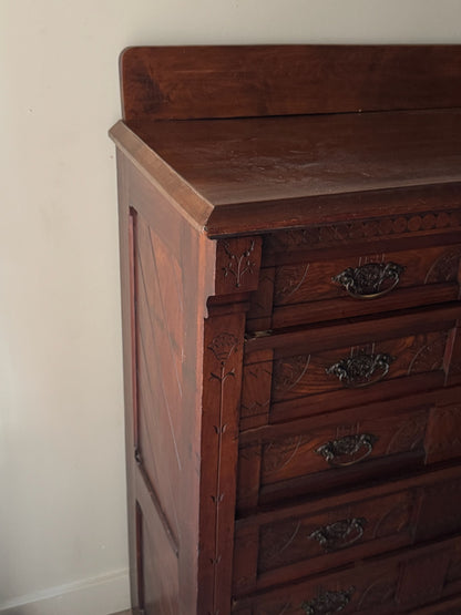 Carved Eastlake walnut dresser with side lock