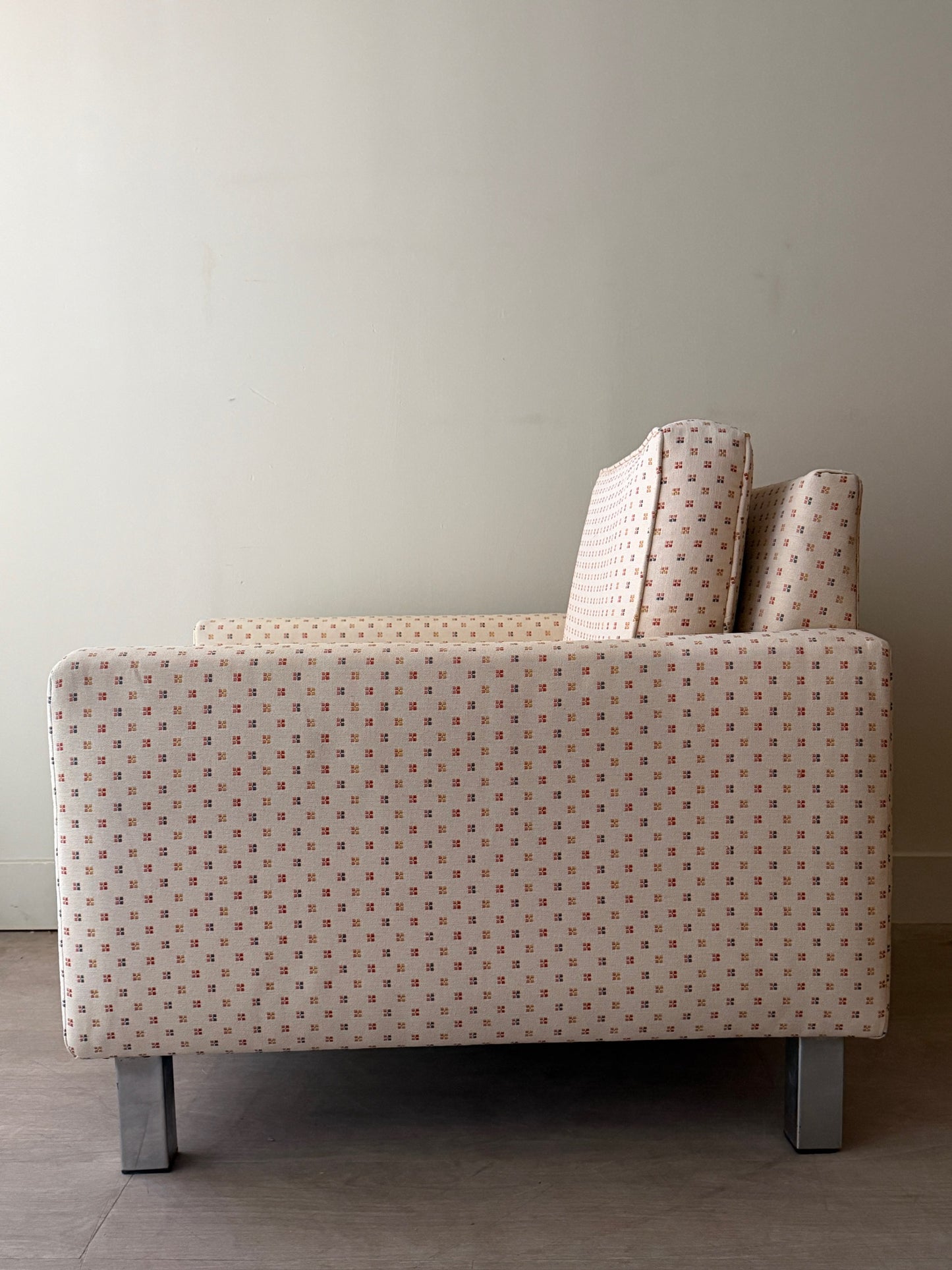 Upholstered chrome armchair