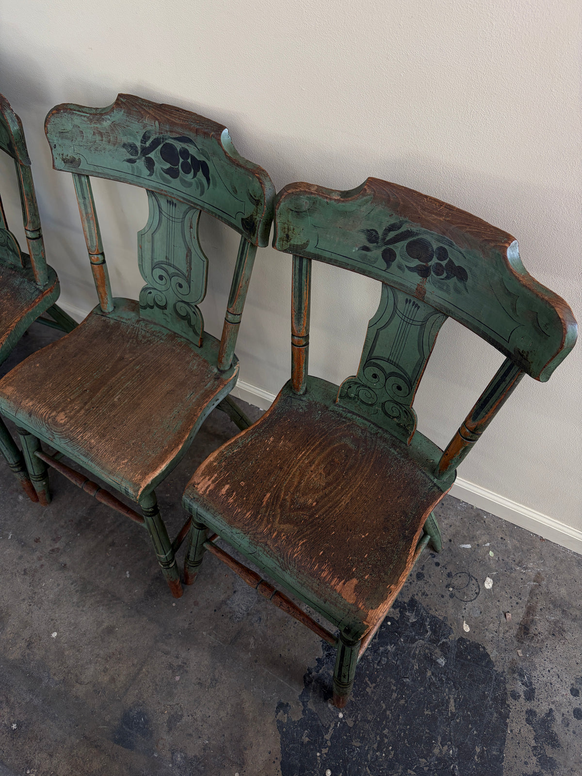 Pennsylvania Sheraton Paint-Decorated Plank Seat Chairs. Sold in pairs.