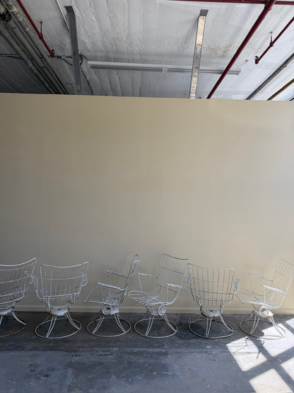 White swivel patio chairs. Sold individually.