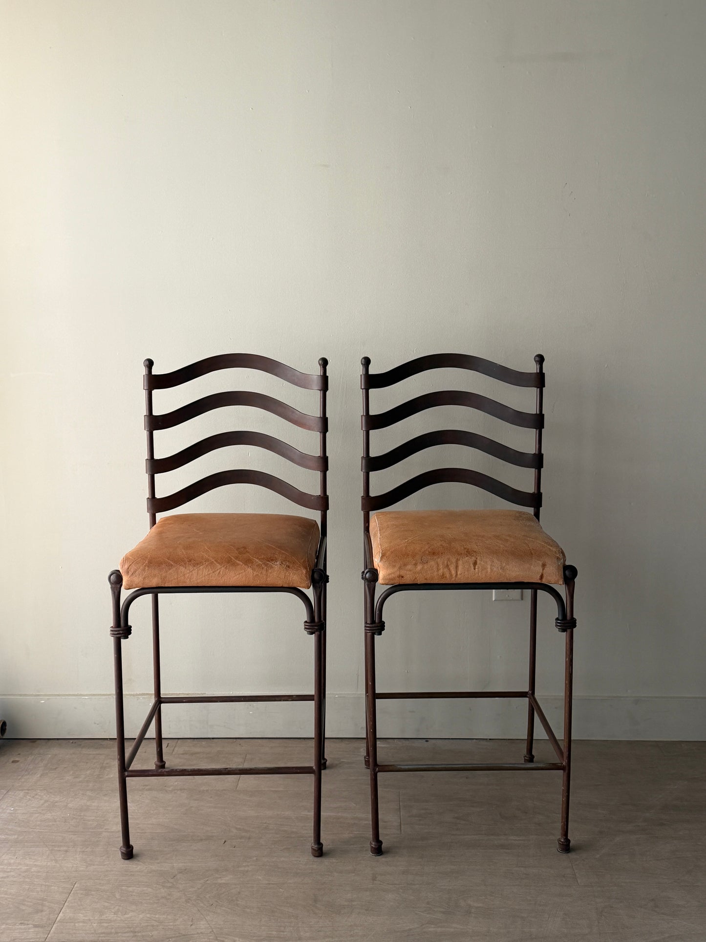 Wrought iron bar stools. Sold as pair.