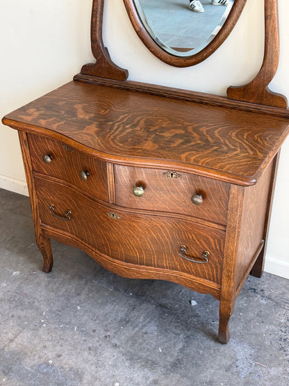 Golden oak dresser with mirror