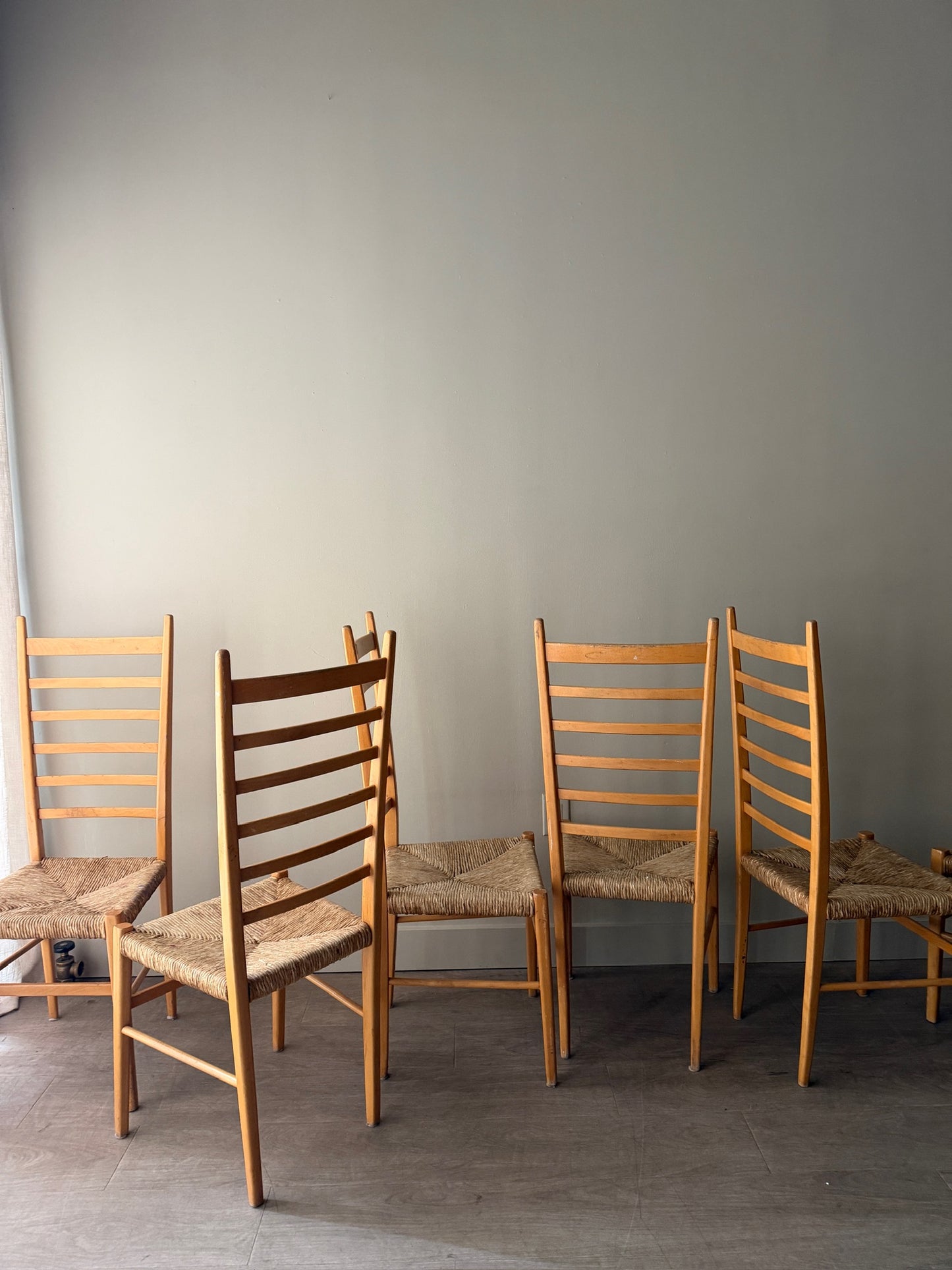 Maple ladder back dining chairs with rush seats. Sold in pairs.