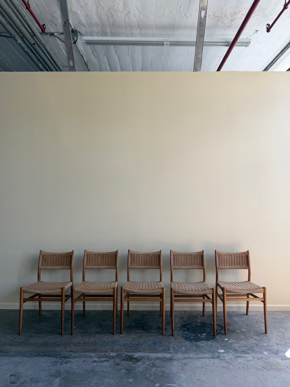 Danish oak and papercord chairs. Sold individually.