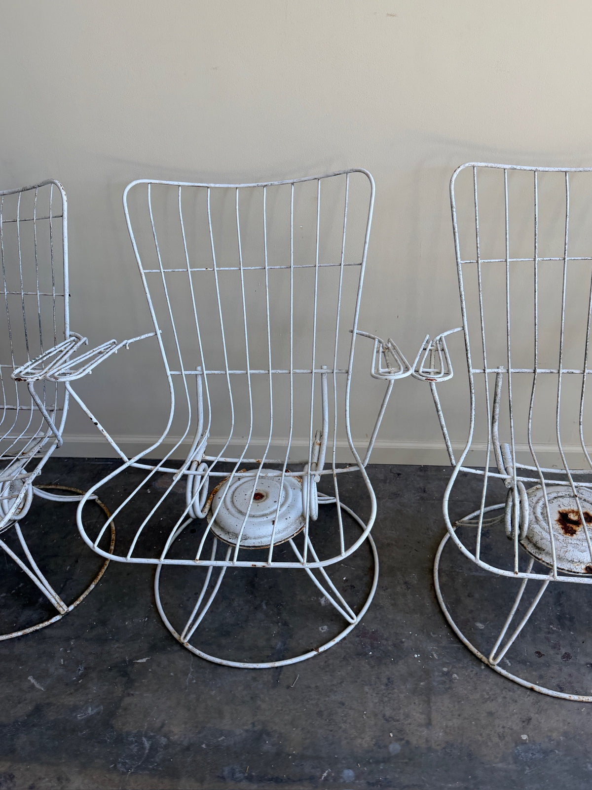 White swivel patio chairs. Sold individually.