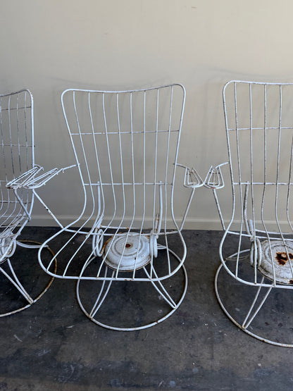 White swivel patio chairs. Sold individually.