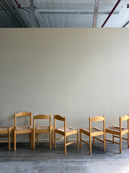 Maple dining chairs with twisted rope seats. Sold in pairs.