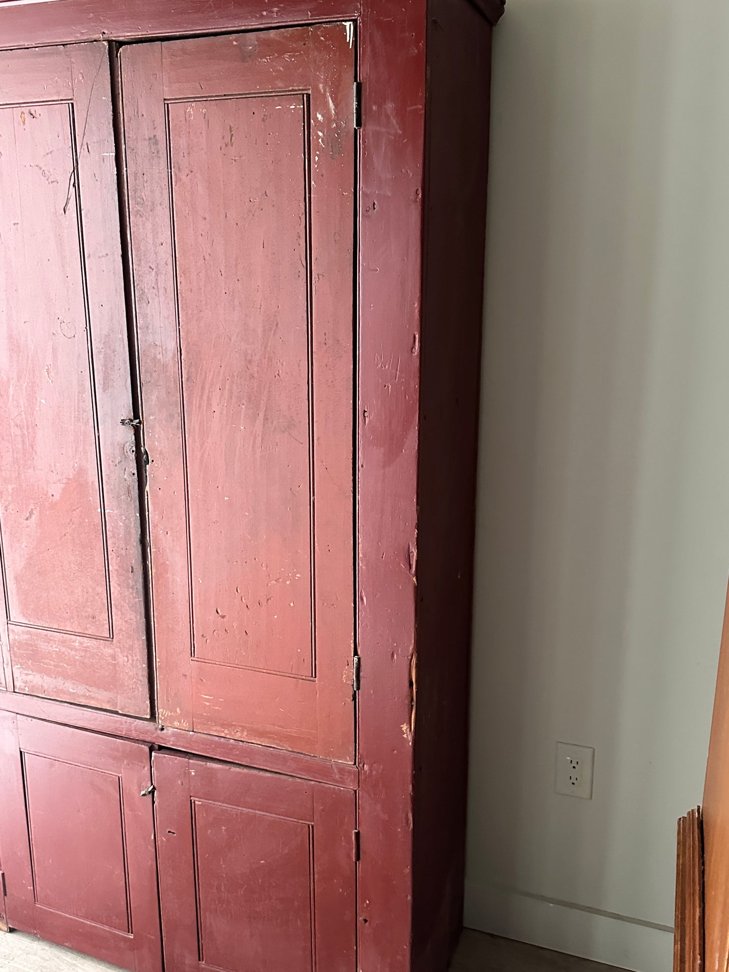 Red painted farmhouse cupboard