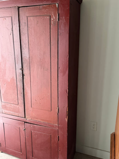 Red painted farmhouse cupboard