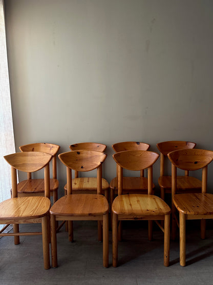 Rainer Daumiller pine cat-eye dining chairs. Sold in sets of 2.