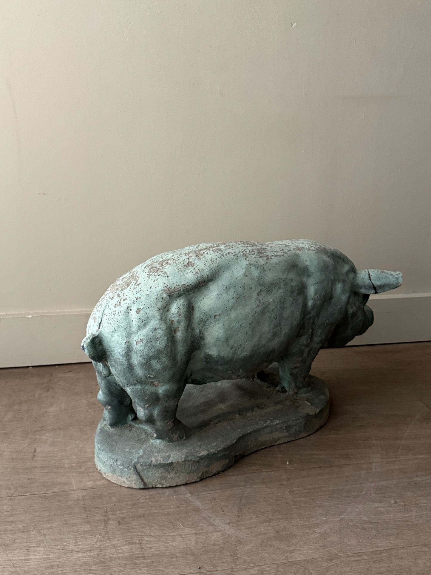 Light blue painted concrete pig