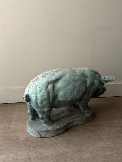 Light blue painted concrete pig