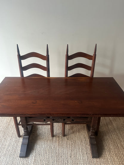 Carved oak trestle table