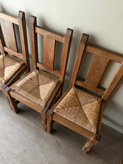 Belgian De Puydt oak & rush dining chairs. Sold in pairs.