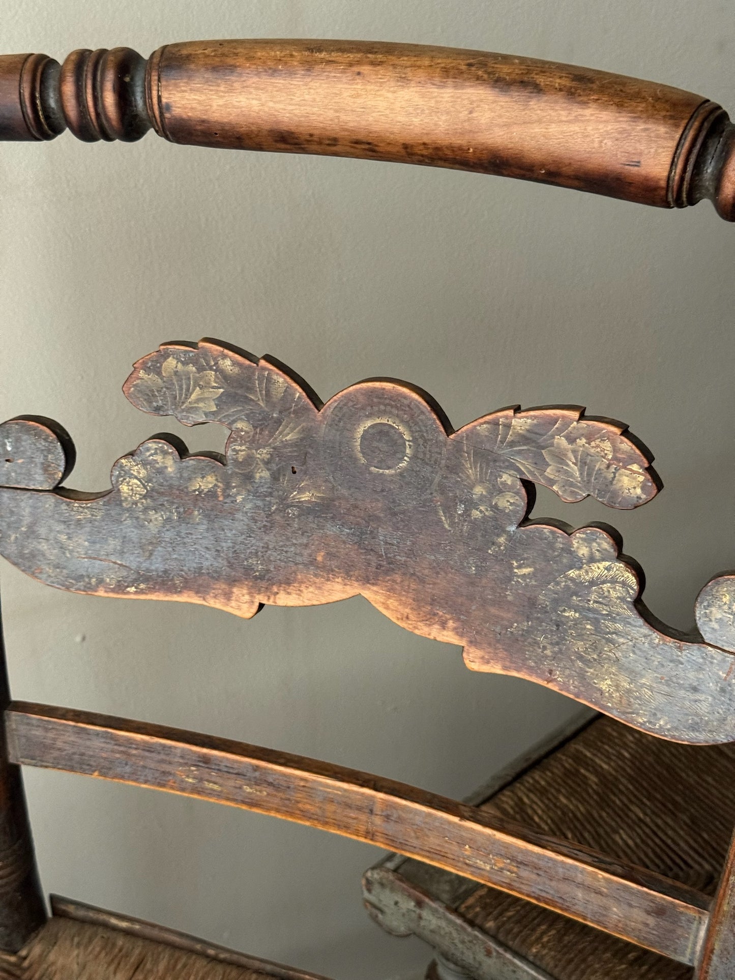 Carved dining chairs with rush seats. Sold in pairs.