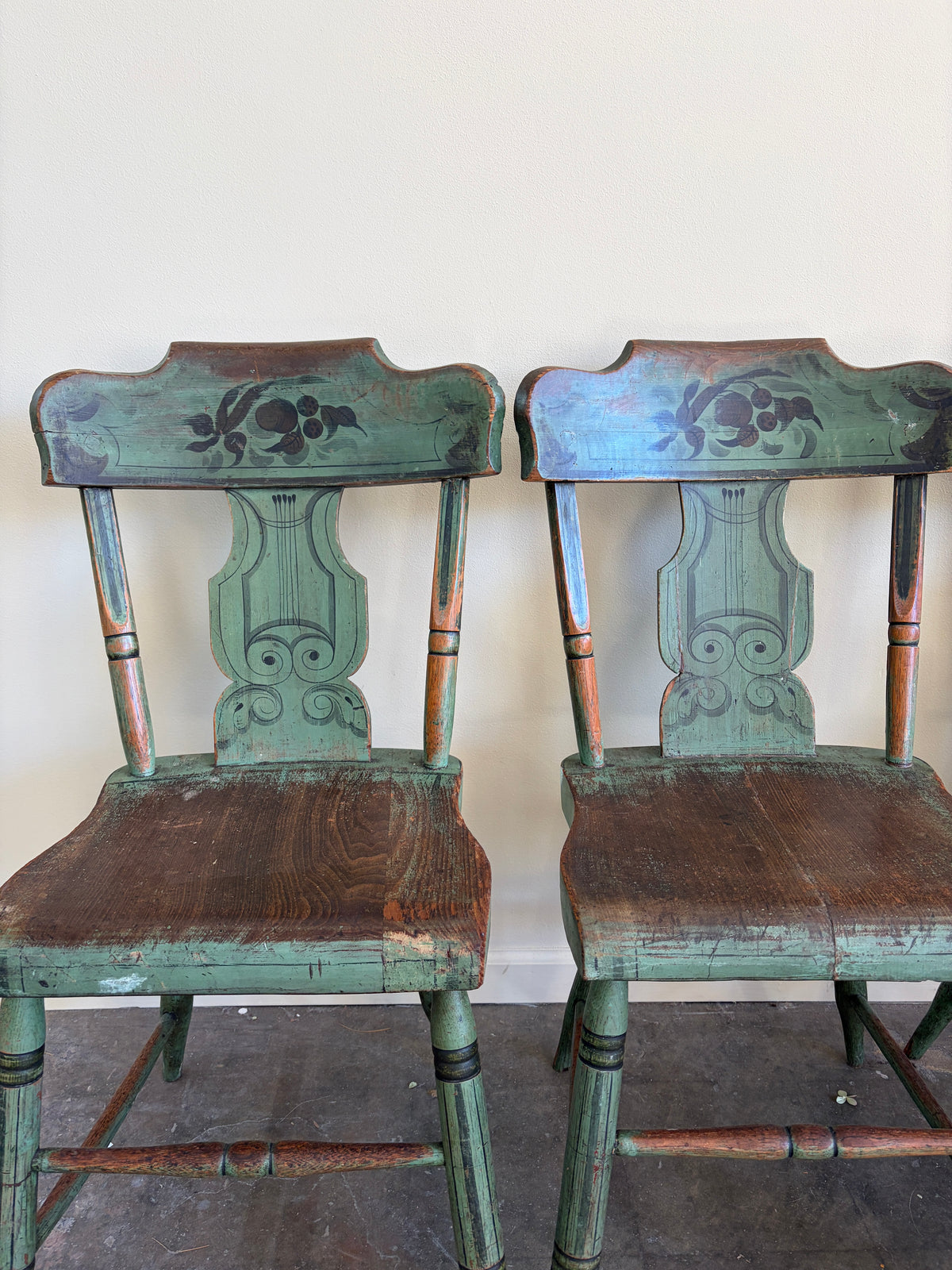 Pennsylvania Sheraton Paint-Decorated Plank Seat Chairs. Sold in pairs.