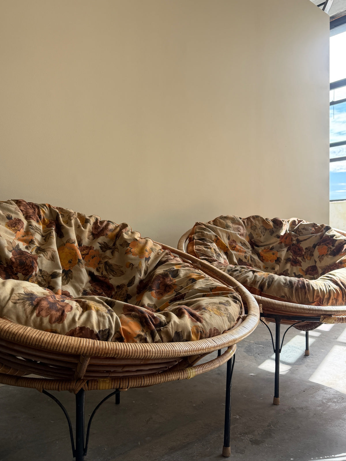 Wicker & metal circular lounge chairs. Sold individually.