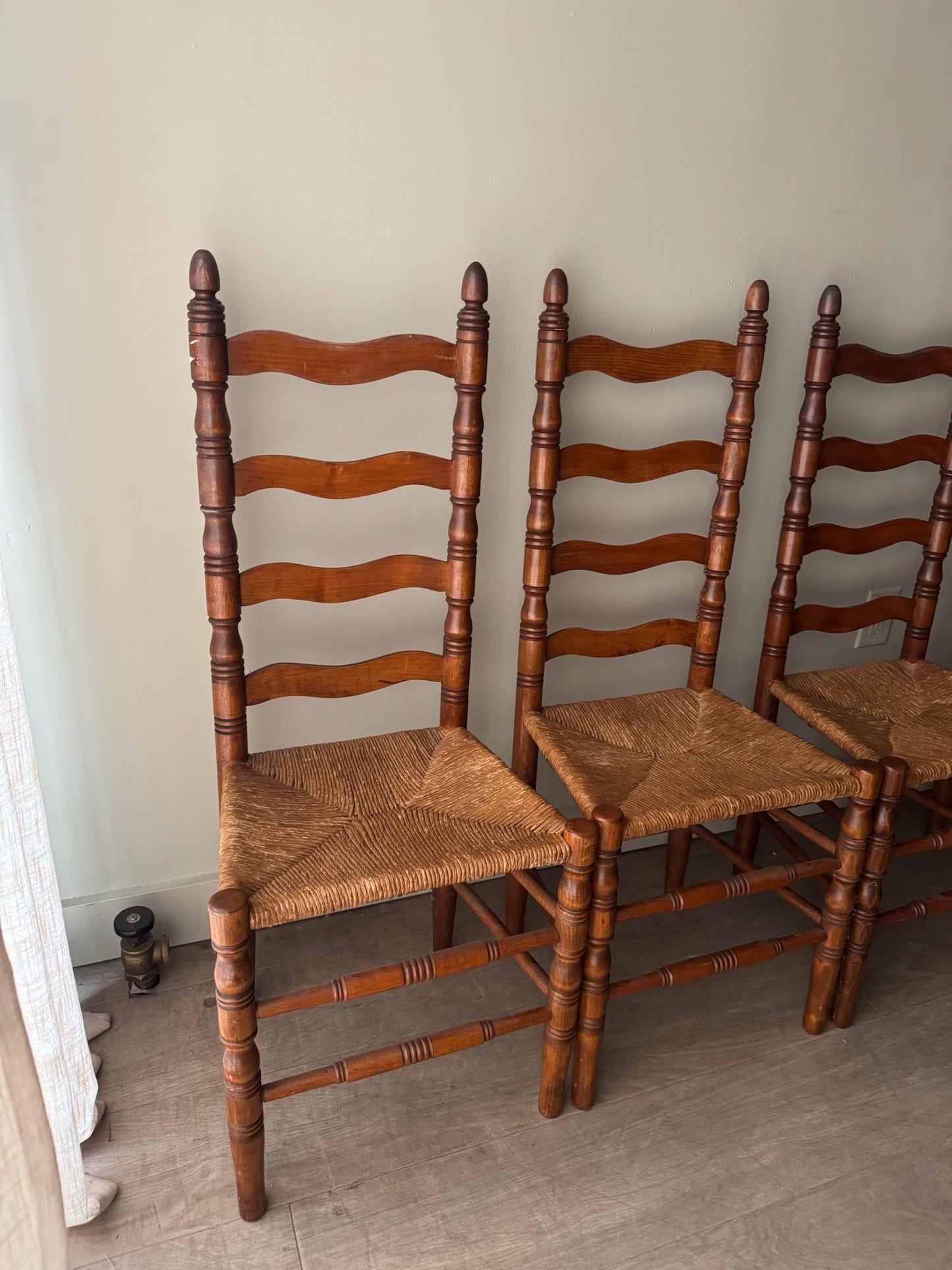 Maple ladder back rush seat chairs. Sold in pairs.