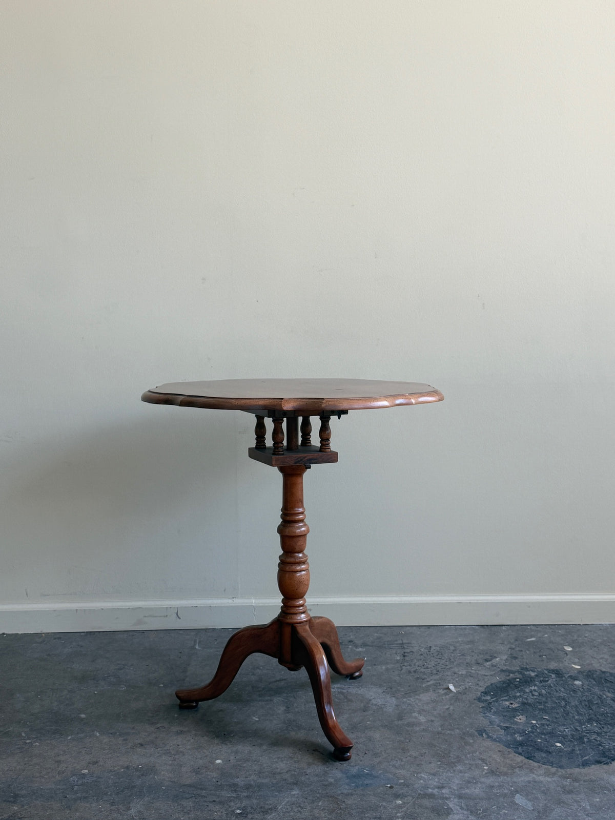 Walnut tilt-top side table