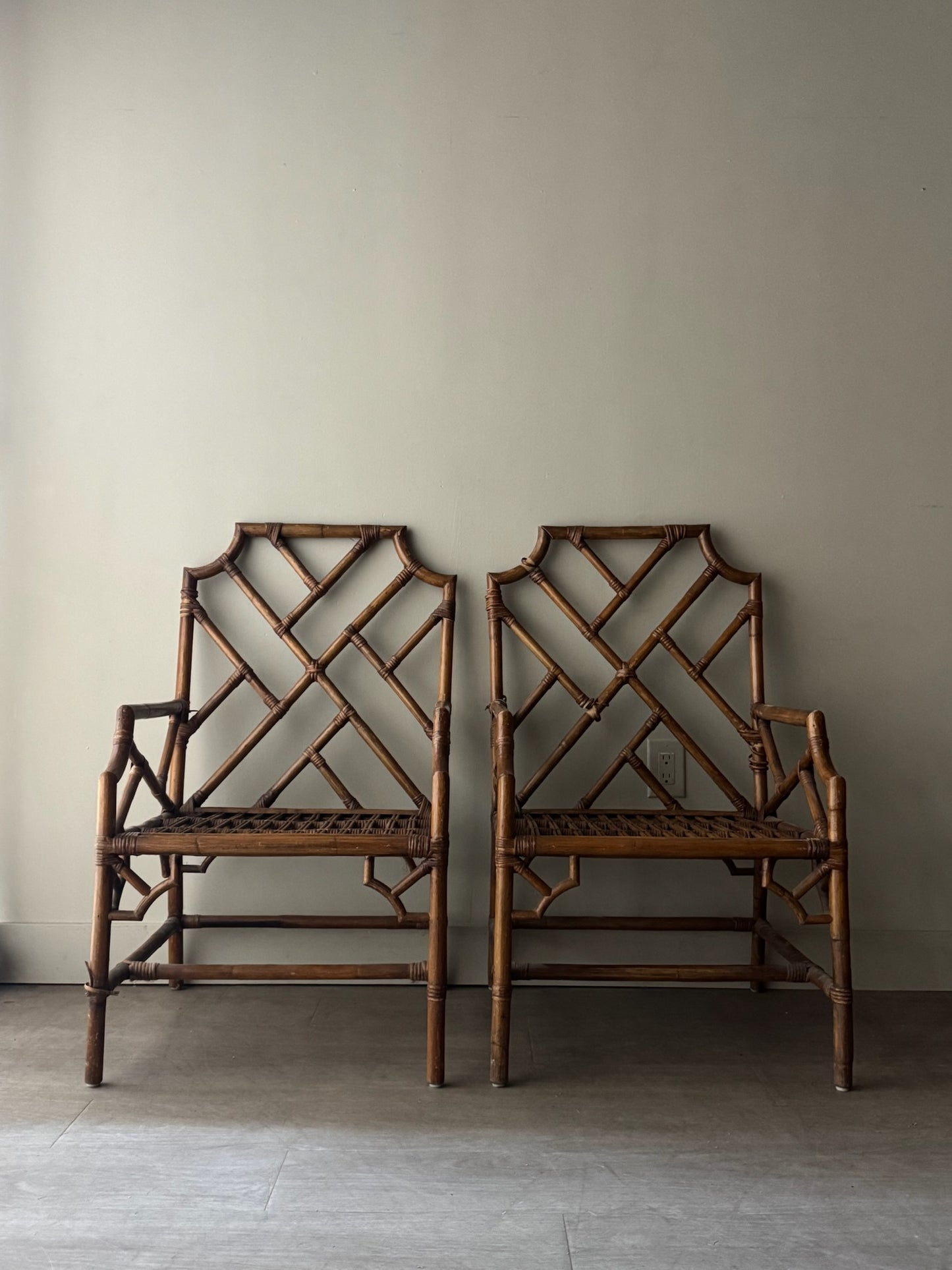 Bamboo arm chairs. Sold individually.