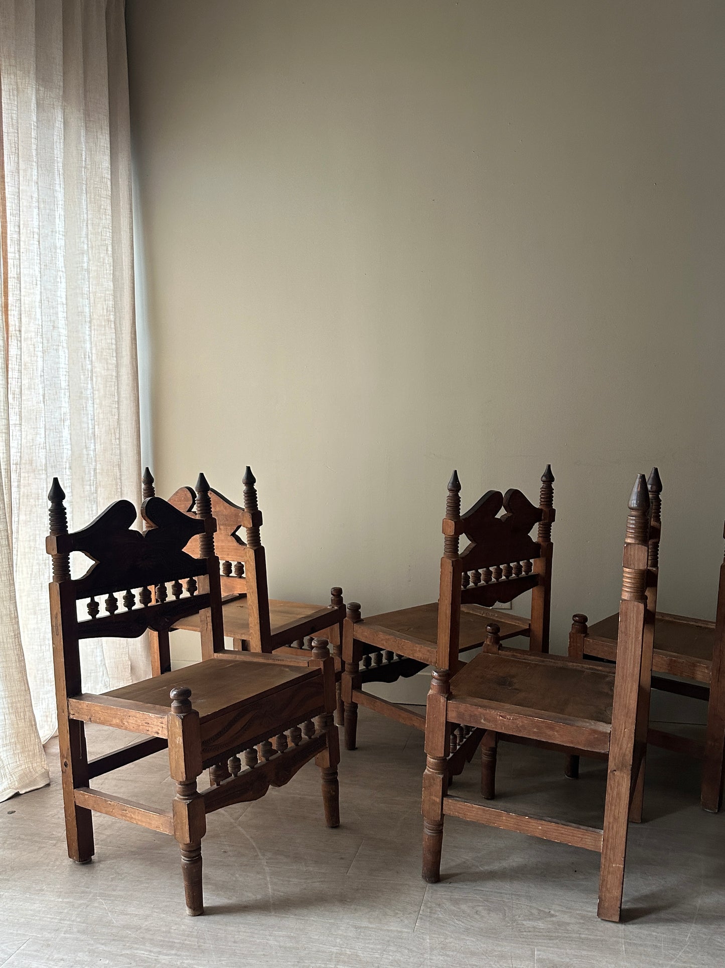 6 hand carved chairs. Sold individually.