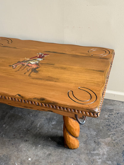 Pine coffee table with equestrian motifs