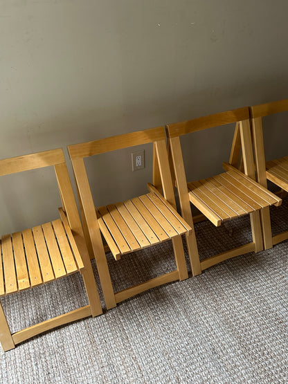 Oak folding chairs. Sold in pairs.