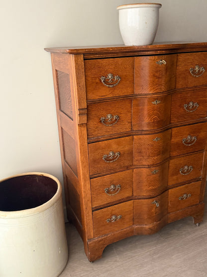 Oak serpentine tallboy dresser