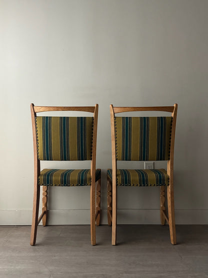 Danish oak dining chairs with striped upholstery. Sold in pairs.