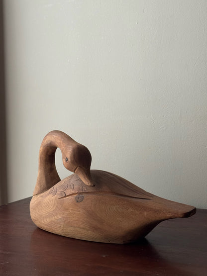 Carved pine swan sculpture