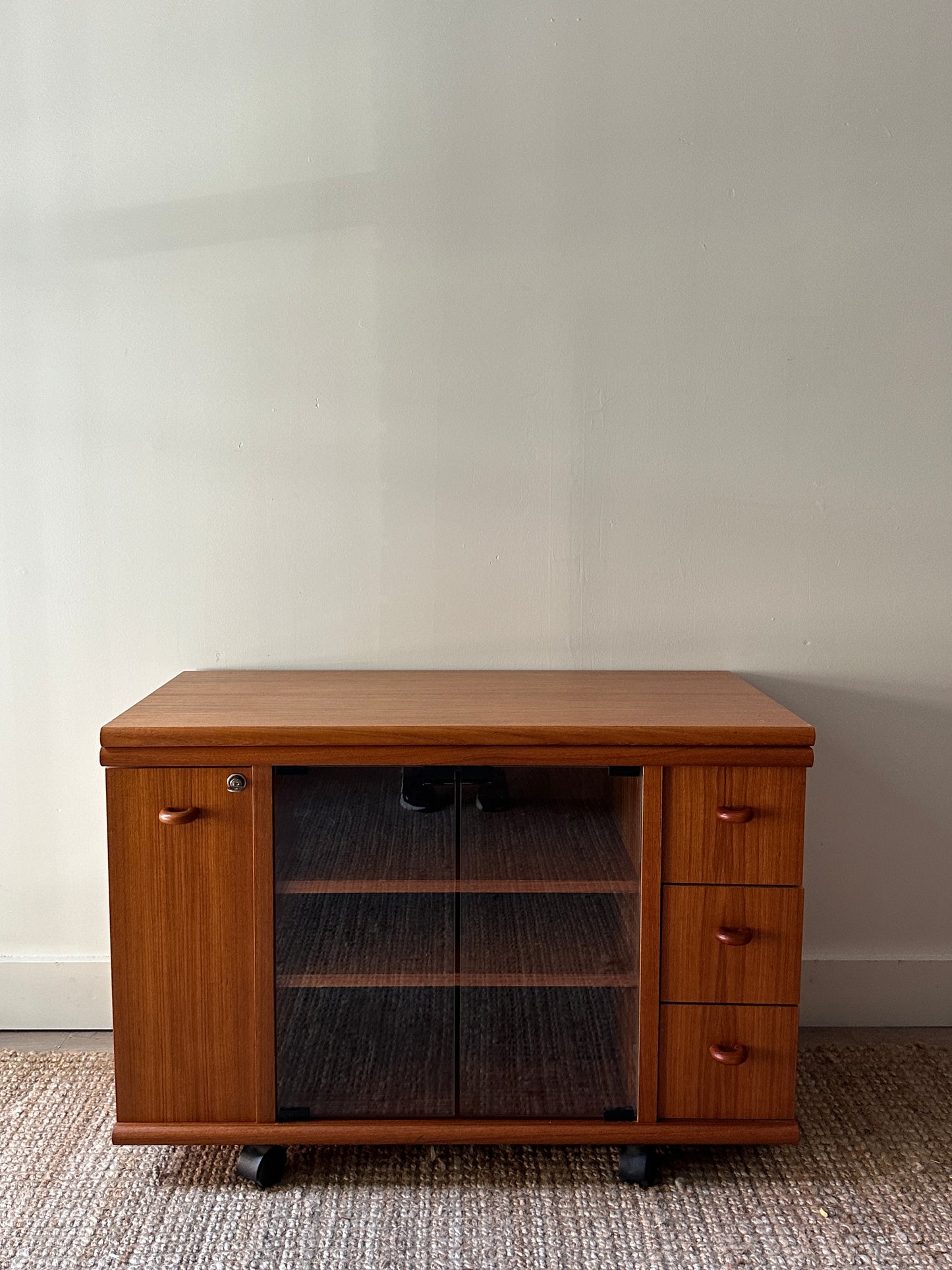 Teak swivel top media cabinet