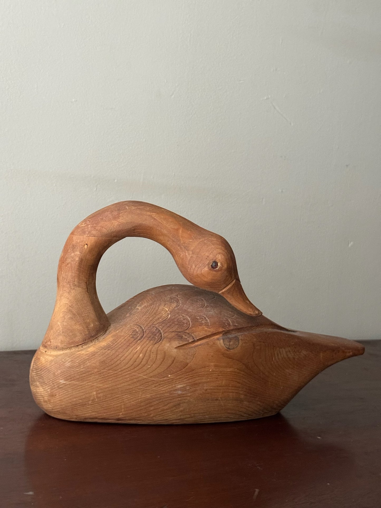 Carved pine swan sculpture