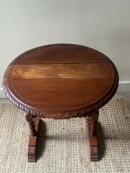 Carved drop leaf entryway table