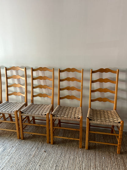 Ladder back chairs with woven seats. Sold in sets of 2.