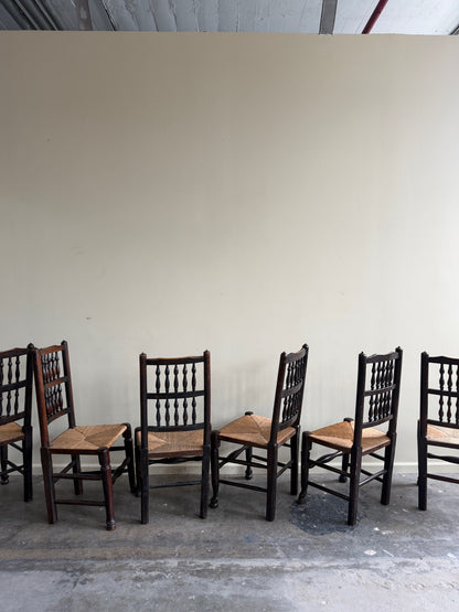 Dutch oak spindle back rush seat dining chairs. Sold in pairs.