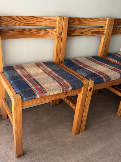 Danish pine plaid upholstered dining chairs. Sold in pairs.