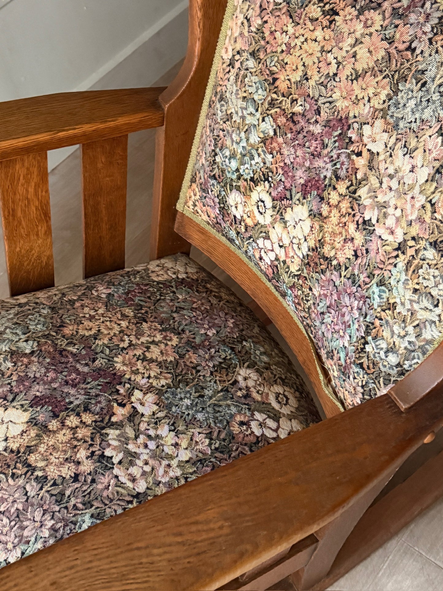 Upholstered golden oak rocking chair