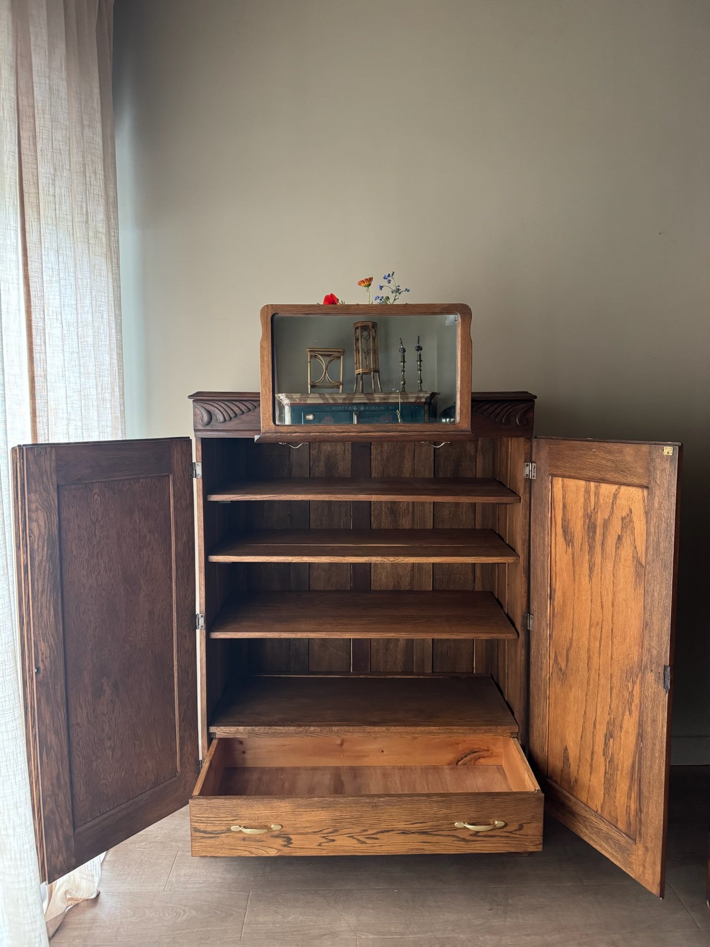 Golden oak cupboard with mirror