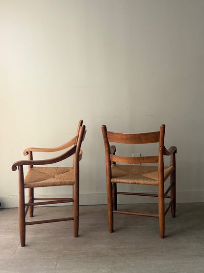 Pine rush seat dining chairs with arms. Sold as a pair.