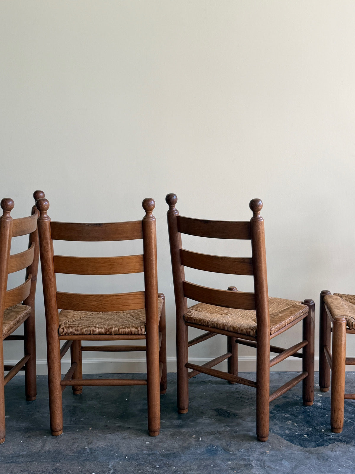 French oak rush seat dining chairs. Sold as a set of 4.