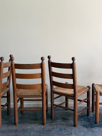 French oak rush seat dining chairs. Sold as a set of 4.