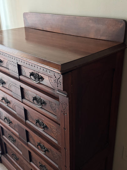 Carved Eastlake walnut dresser with side lock