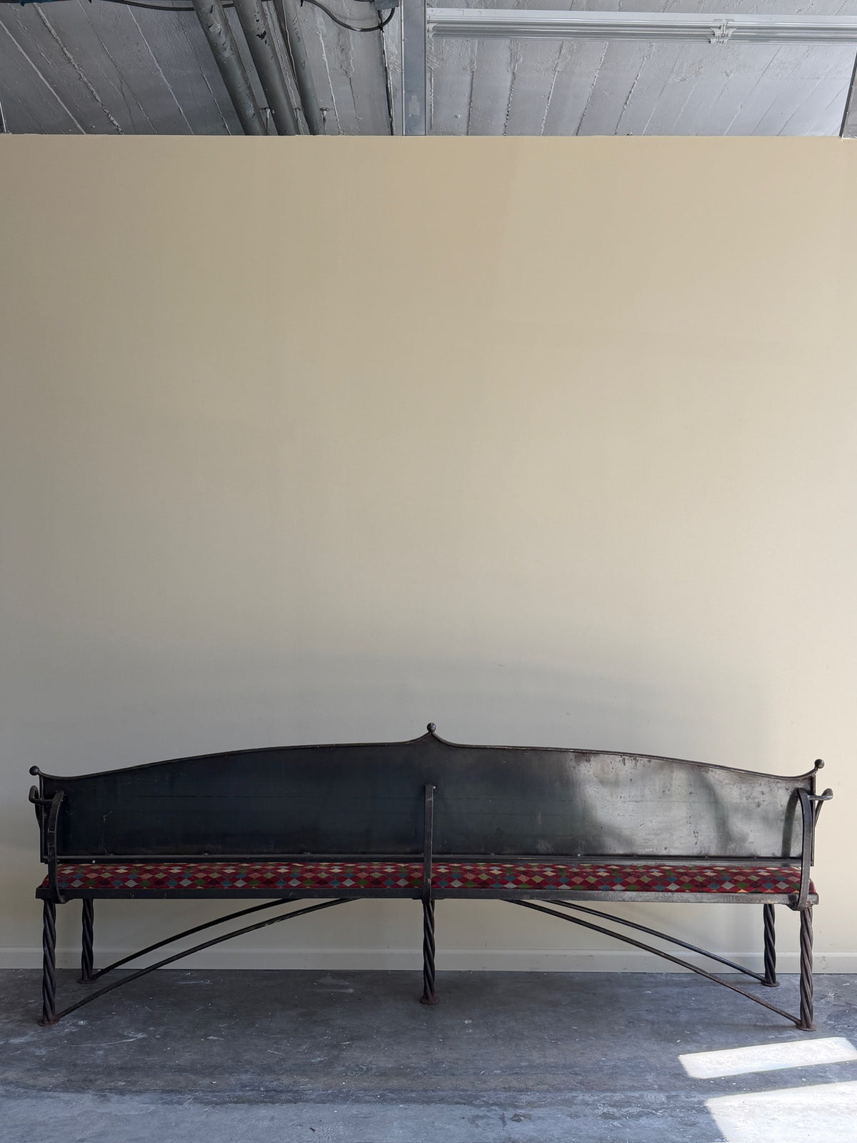 Wrought iron sculptural bench