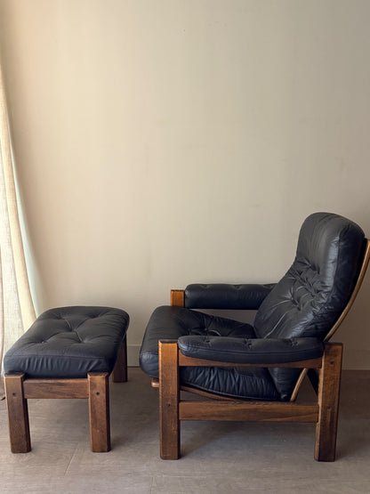 Reclining leather armchair with ottoman