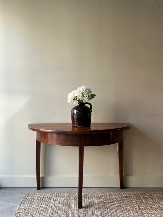 Half moon entryway tables. Sold individually.