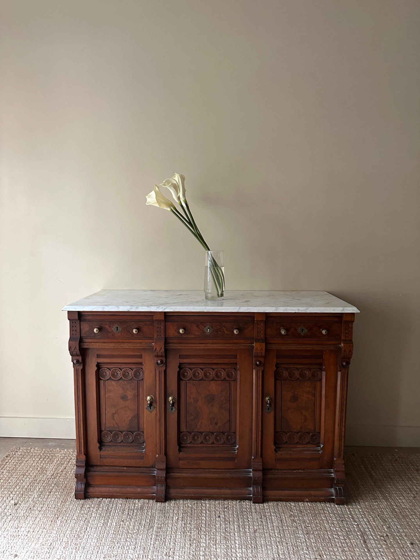 Carved walnut marble top sideboard