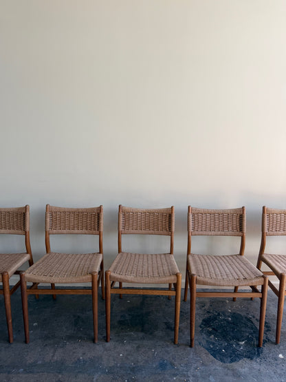Danish oak and papercord chairs. Sold individually.