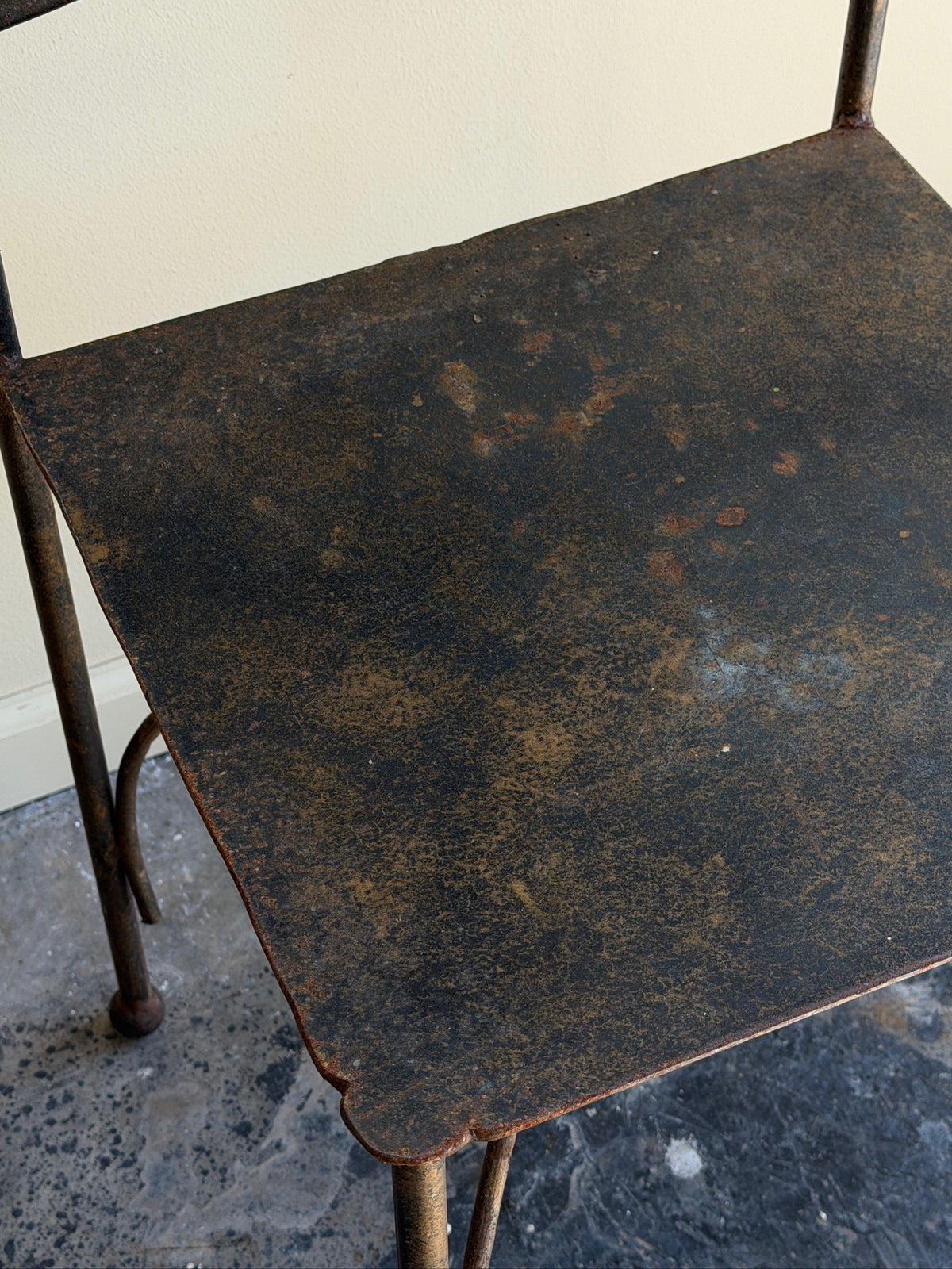 Wrought iron sculptural chairs (left)