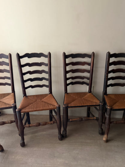 English provincial elmwood ladder back rush seat chairs. Sold in pairs.