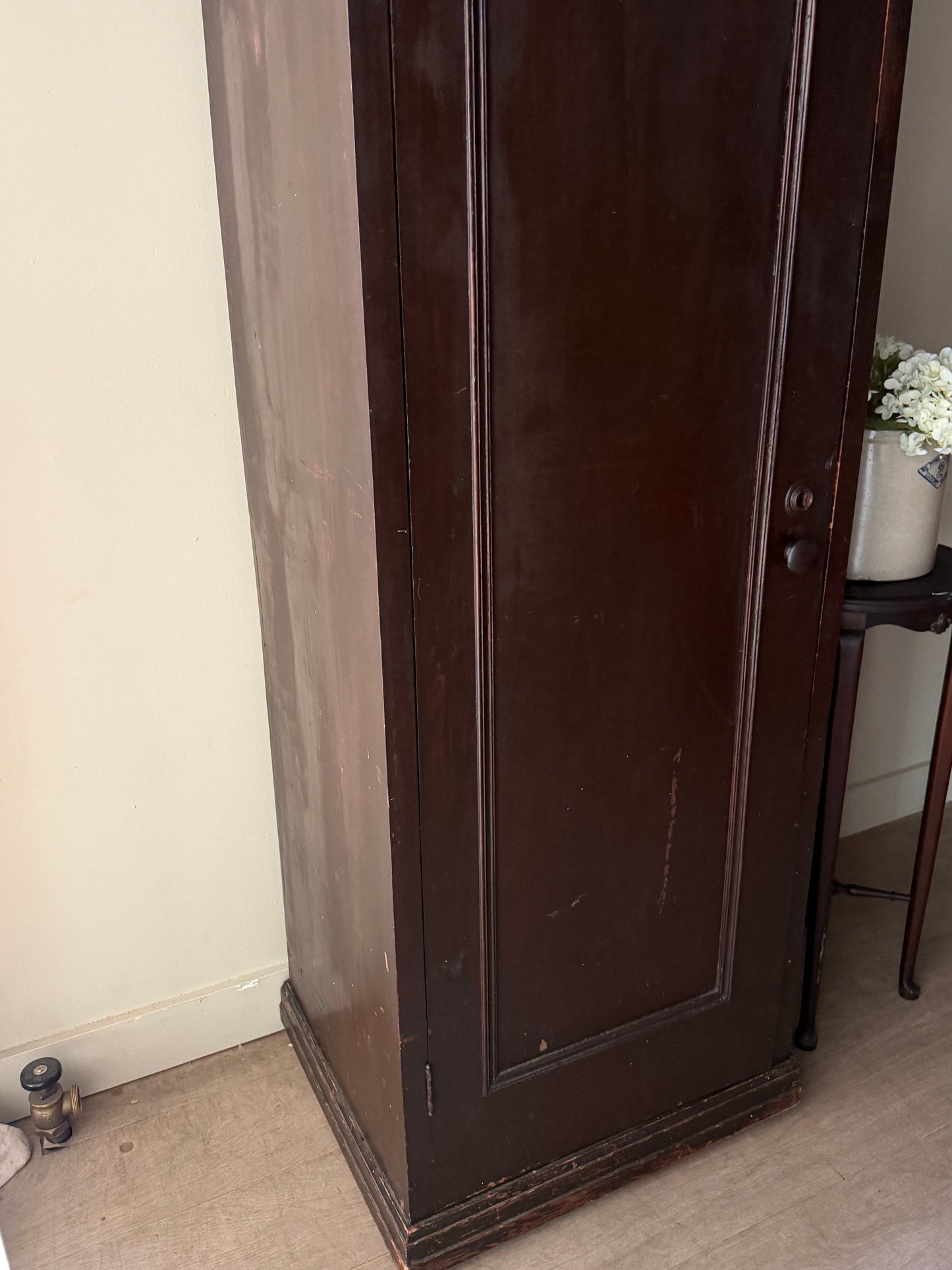 Dark stained chimney cupboard